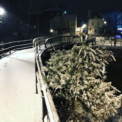 View of illuminated bridge in city at night