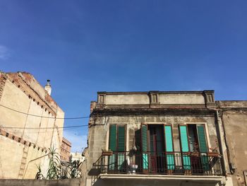 Low angle view of abandoned building against sky