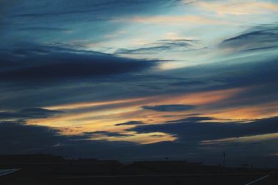 Scenic view of cloudy sky at sunset