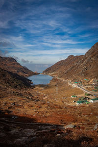 Himalayan breathtaking landscape with bright blue sky and twisty adventurous valley road