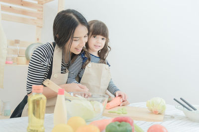 Girl and woman having food