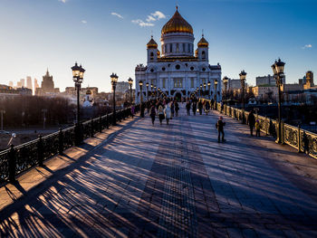 People walking on patriarshy bridge leading towards temple of christ the savior