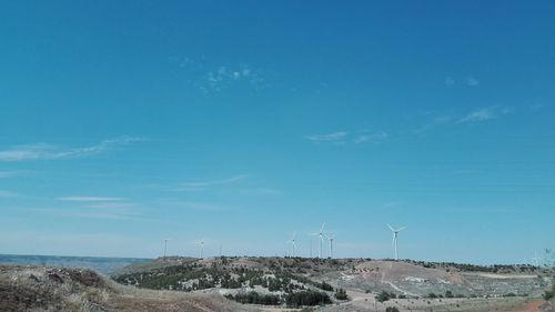 Scenic view of landscape against blue sky