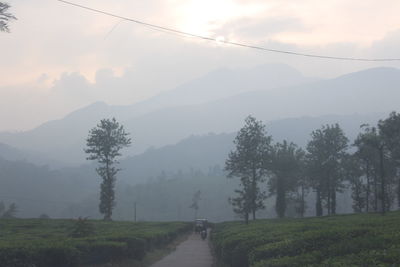 Scenic view of landscape and mountains against sky