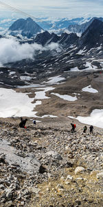 High angle view of people on snowcapped mountain