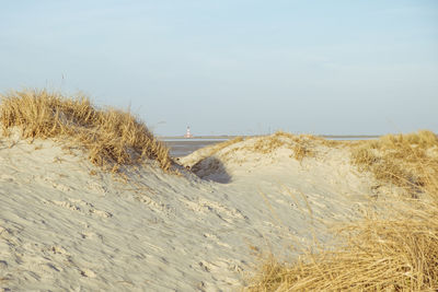 Scenic view of beach against sky