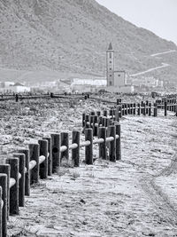 Wooden posts on beach against sky in cabo de gata, spain