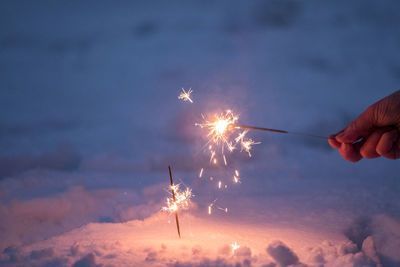 Low angle view of firework display at night