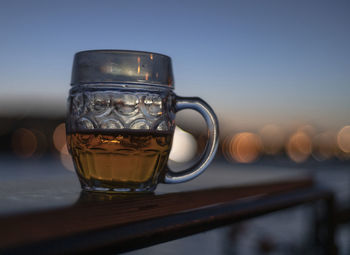 Glass of czech beer at sunset