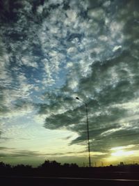 Low angle view of cloudy sky at sunset