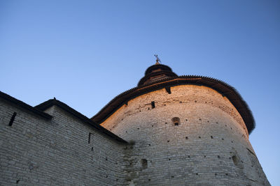 Low angle view of historical building against blue sky