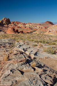 Scenic view of colorful desert hills against sky