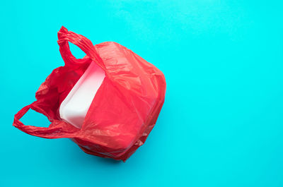 Close-up of red box against blue background