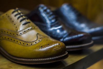 Close-up of shoes on table