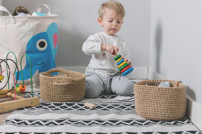 Side view of woman holding wicker basket