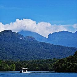 Scenic view of lake with mountains in background