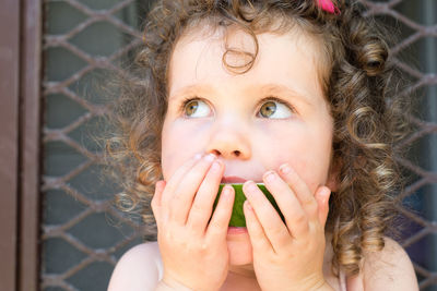 Close-up portrait of girl eating ice cream