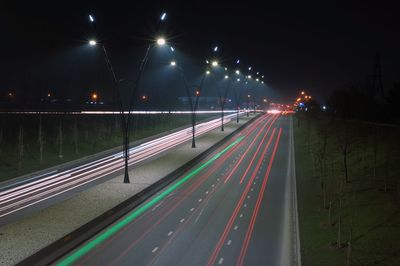 High angle view of light trails on road at night