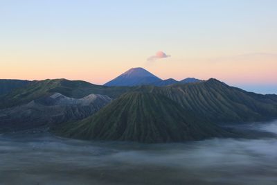 View of volcanic mountain against sky during sunset