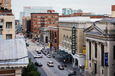 High angle view of traffic on road amidst buildings in city