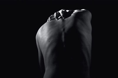 Close-up of hands over black background