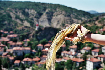 A woman  holding scarf