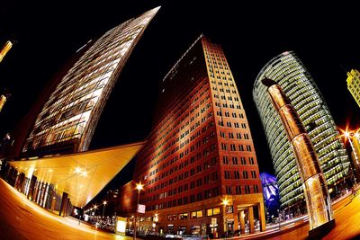 Low angle view of illuminated ferris wheel at night