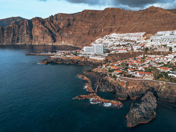 High angle view of townscape by sea