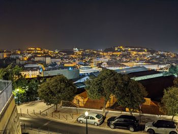 High angle view of illuminated buildings in city at night