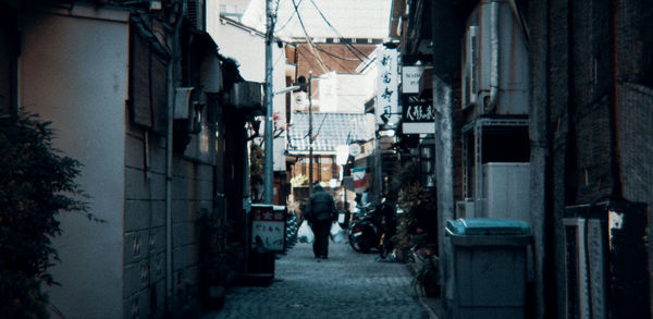 Narrow street amidst buildings in town