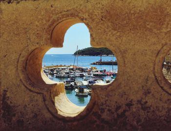 Scenic view of sea seen through arch