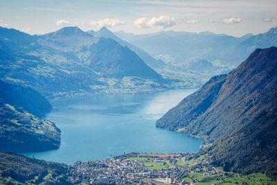 Scenic view of lake and mountains against sky