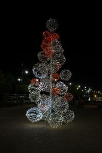 Illuminated christmas tree at night
