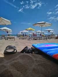 View of lounge chairs on beach