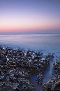 Scenic view of sea against sky at sunset