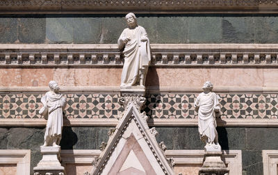 Two prophets and the redeemer, portal of cattedrale di santa maria del fiore, florence, italy