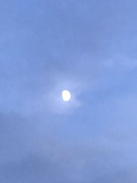 Low angle view of moon against sky at night