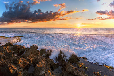 Scenic view of sea against sky during sunset