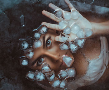 High angle view of hands in water