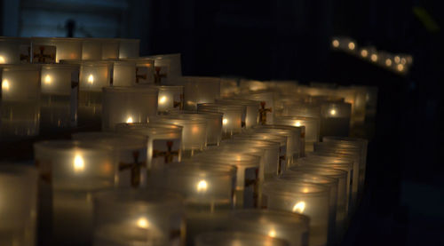 Illuminated candles in building