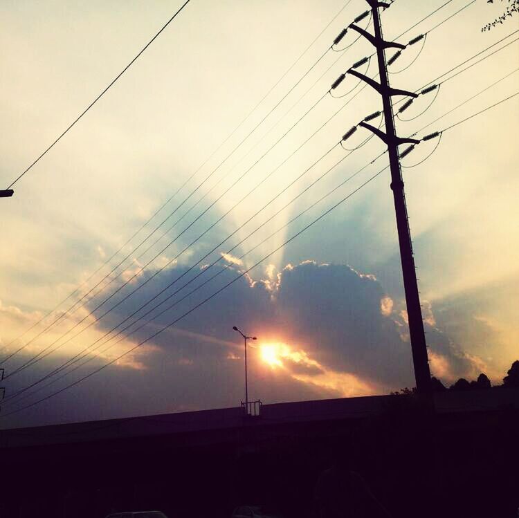 power line, electricity pylon, cable, power supply, electricity, connection, sky, silhouette, fuel and power generation, sunset, power cable, cloud - sky, low angle view, technology, cloud, built structure, transportation, cloudy, no people, outdoors