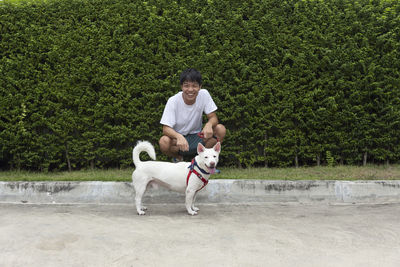 Playful dogs running on field