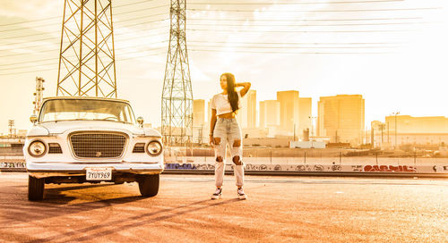 Man standing in city against sky