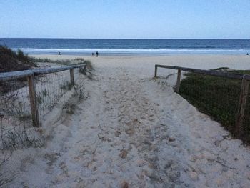 Scenic view of beach against clear sky