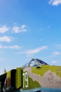 Abandoned airplane against blue sky