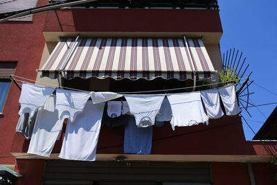 Low angle view of clothes drying on balcony