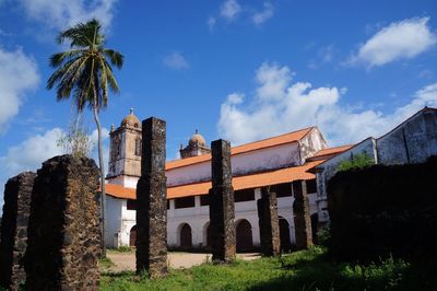 Low angle view of old built structure against blue sky