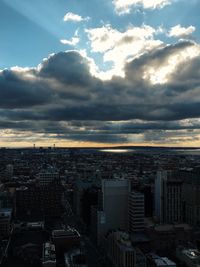 High angle view of cityscape against cloudy sky