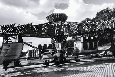 Low angle view of amusement park ride against sky