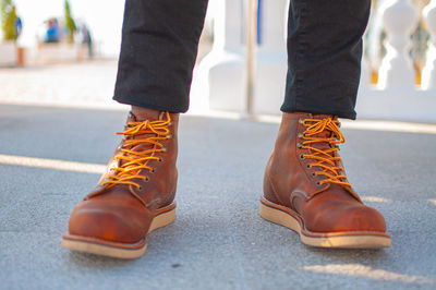 Low section of people standing on road